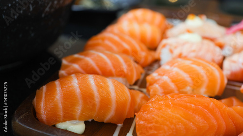 Salmon Sushi Japanese food. on the table in restaurant. Japanese cuisine set of Sashimi Salmon sushi nigiri. 