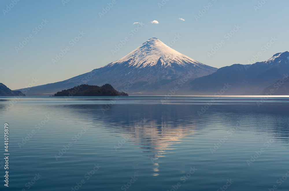 Osorno volcano snowcapped peak by All Saints Lake near Puerto Varas, Chilean lake district, Chile.