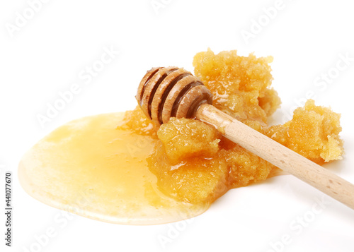 naturally crystallized rape honey on white wooden photo
