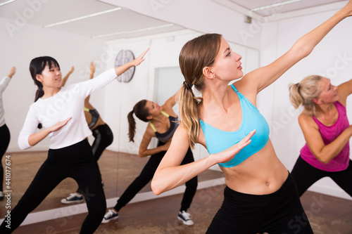Women dancing aerobics at lesson in the dance class © JackF
