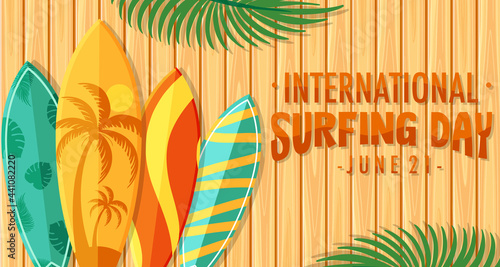 International Surfing Day font with many surfboards on wooden background