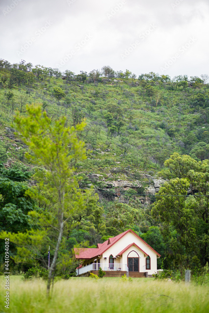 Cellar door at vineyard nestled under slope of hill - old church building Cellar door at vineyard nestled under slope of hill - old church building
