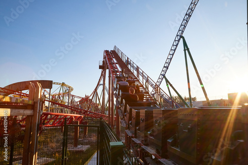 Roller coaster Ride against blue sky in a nice day. © keleny