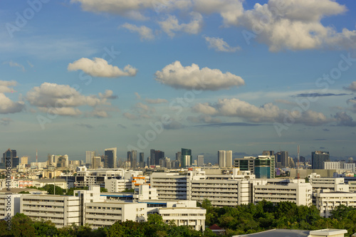 clouds over the city with blue ske photo