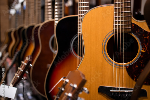 Classic acoustic guitars for sale in music shop.