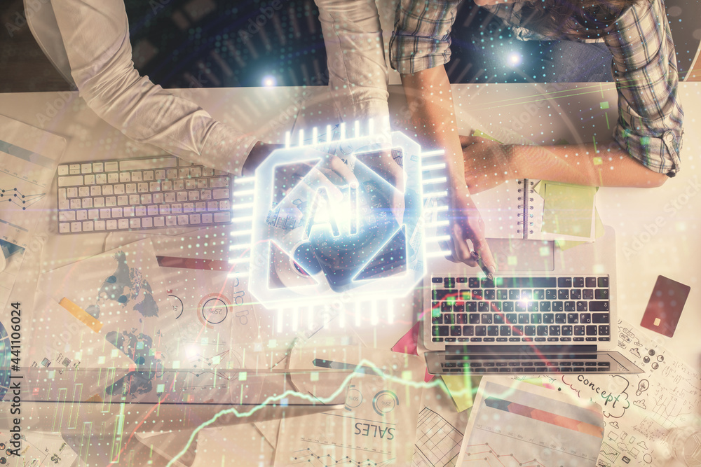 Double exposure of man and woman working together and data theme hologram drawing. Computer background. Top View. Double exposure of man and woman working together and data theme hologram drawing. Computer background. Top View.