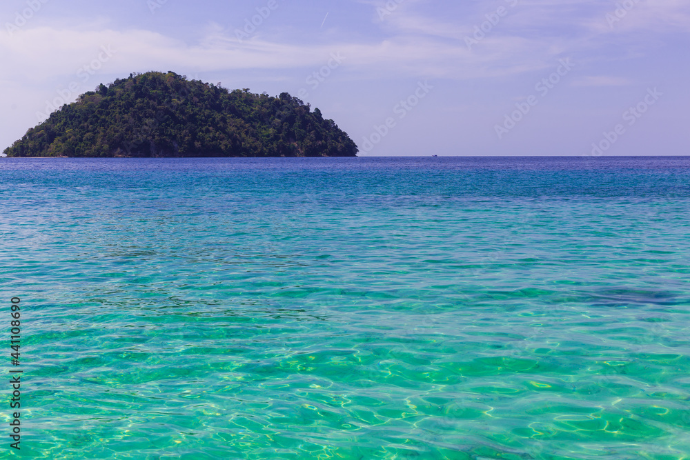 Fototapeta premium island in the calm sea clear water and blue sky
