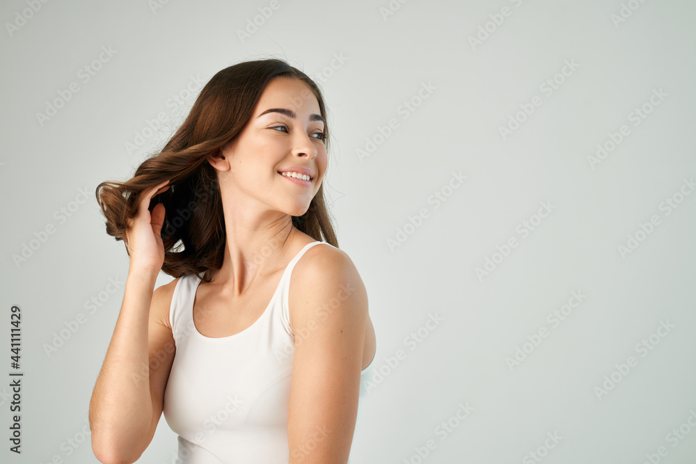pretty brunette in white t shirt hairstyle grooming isolated background pretty brunette in white t shirt hairstyle grooming isolated background