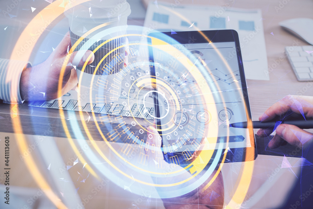 Double exposure of man's hands holding and using a digital device and tech theme hologram drawing. Technology concept. Double exposure of man's hands holding and using a digital device and tech theme hologram drawing. Technology concept.