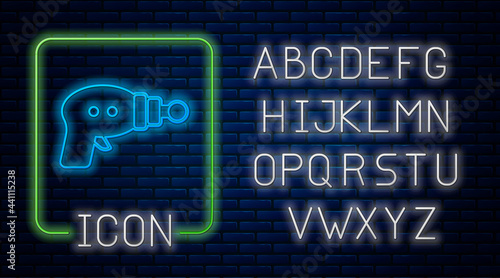 Glowing neon Ray gun icon isolated on brick wall background. Laser weapon. Space blaster. Neon light alphabet. Vector