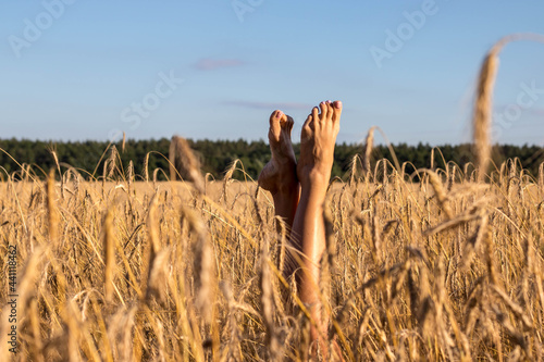 beautiful legs sticking out in the field