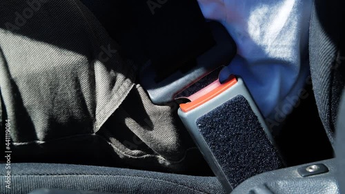 Concept driving car. Driver or passenger fastening a three-point car seat belt. Car safety and driver.