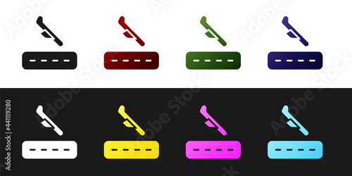 Set Plane landing icon isolated on black and white background. Airplane transport symbol. Vector