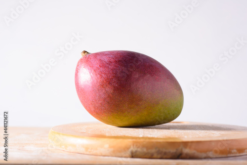 Fresh palmer mango fruit on wooden with white background, Tropical fruit photo
