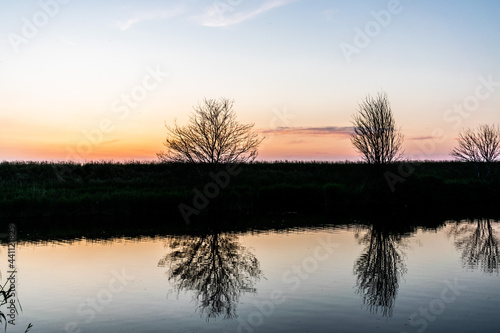 Sunset with reflection in the water in the Netherlands