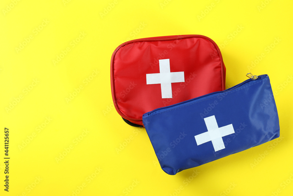 First aid medical kits on yellow background