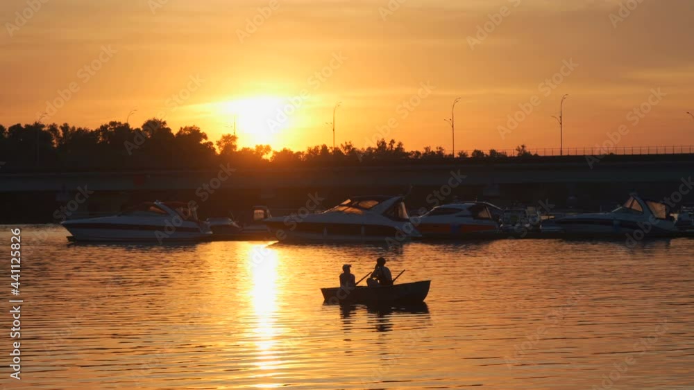 Boat ride. Boat trip. Beautiful sunset. Couple resting together Boat ride. Boat trip. Beautiful sunset. Couple resting together