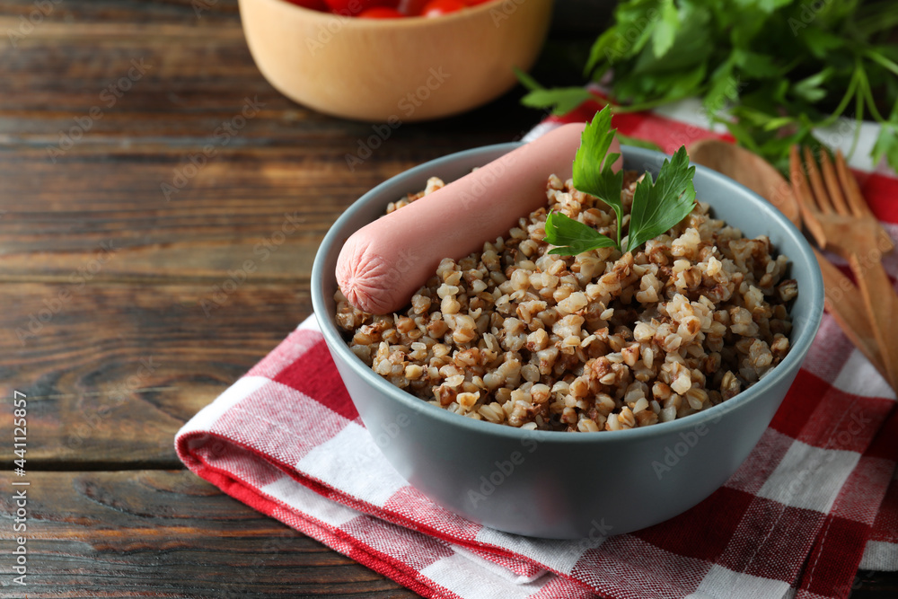 Concept of tasty eating with buckwheat on wooden table Concept of tasty eating with buckwheat on wooden table
