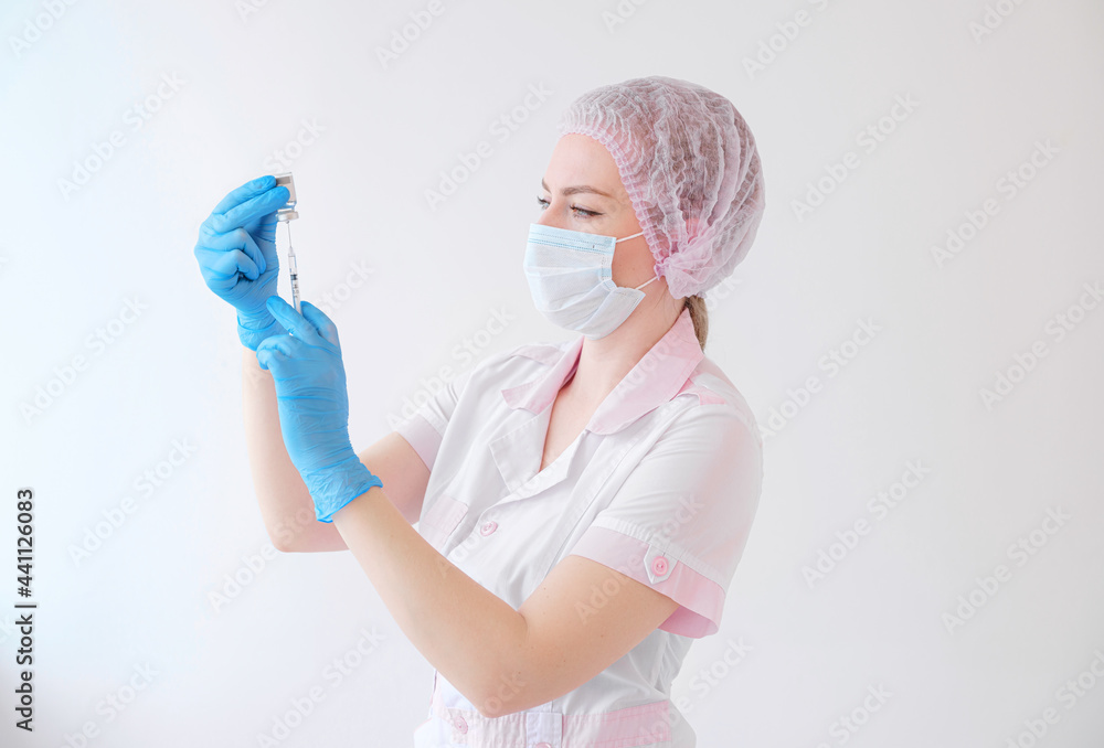 Female doctor holding syringe and COVID-19 vaccine. Healthcare And Medical concept. Female doctor holding syringe and COVID-19 vaccine. Healthcare And Medical concept.