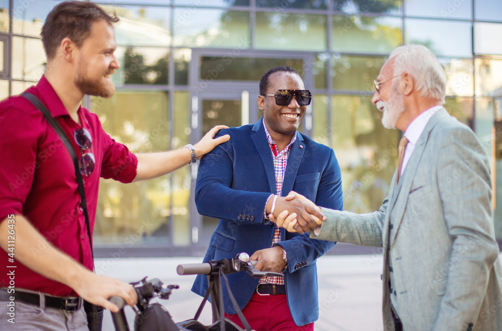Small Group of business men talking on the street. Small Group of business men talking on the street.