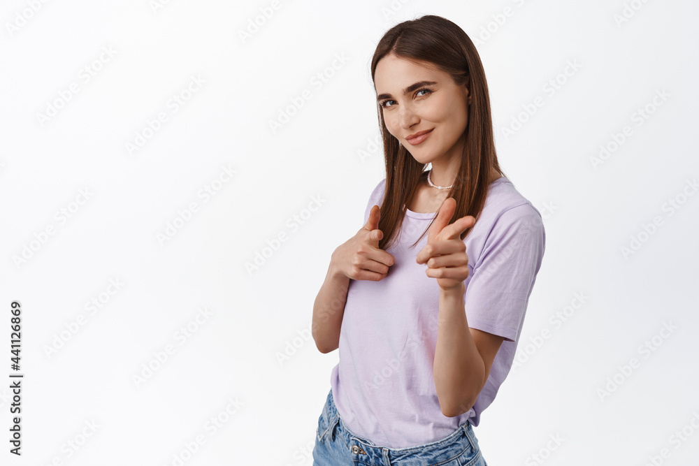 You got this. Smiling young woman pointing fingers at camera, searching and recruiting candidates, inviting people, encourage try something, standing against white background You got this. Smiling young woman pointing fingers at camera, searching and recruiting candidates, inviting people, encourage try something, standing against white background