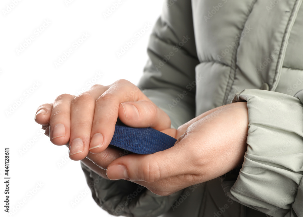 Woman holding hand warmer on white background, closeup