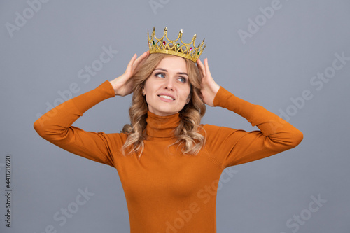 pretty blonde woman with curly hair wear crown, selfish