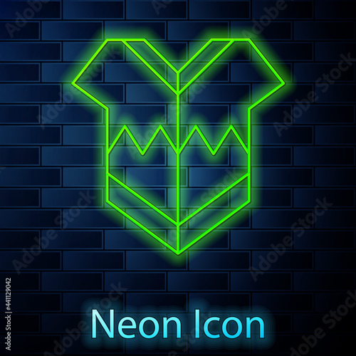 Glowing neon line Traditional mexican poncho clothing icon isolated on brick wall background. Vector