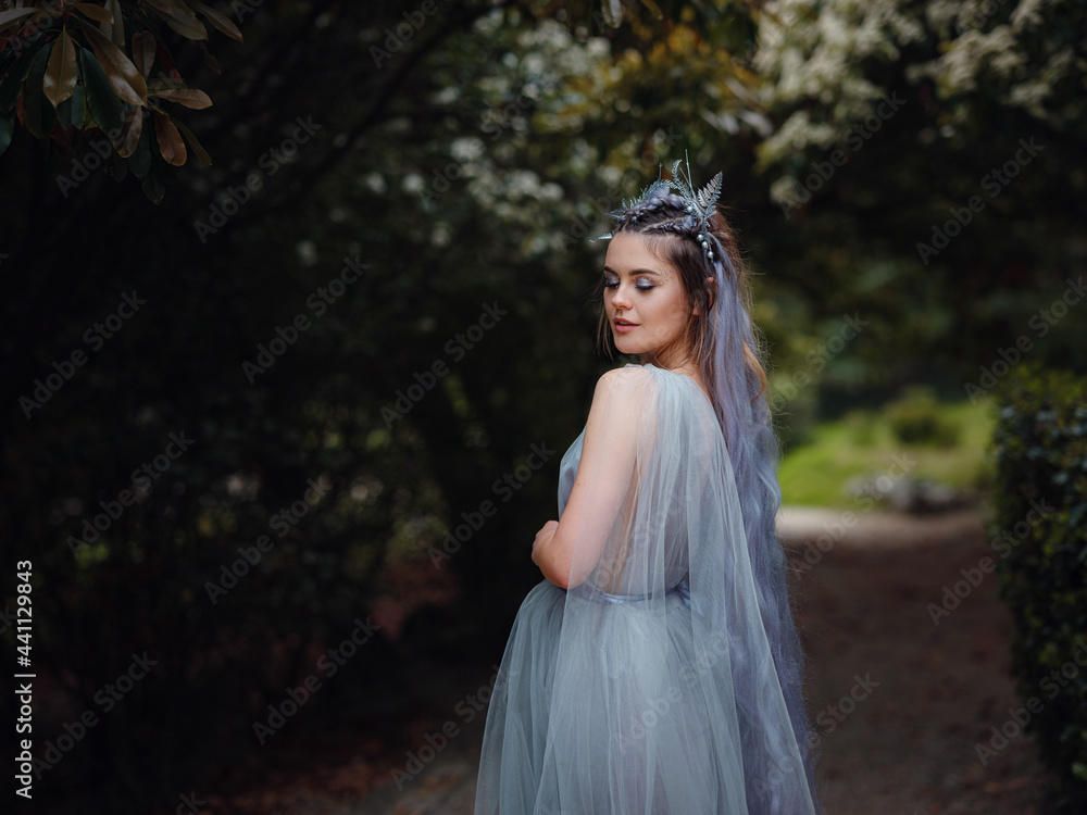 a beautiful woman like a fairy or nymph walking in the park a beautiful woman like a fairy or nymph walking in the park