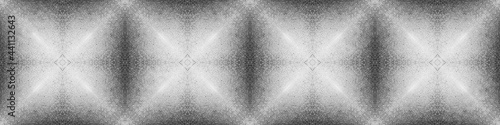 Festive background with an embossed texture and a silver hue. Kaleidoscope abstract pattern for textiles and design.