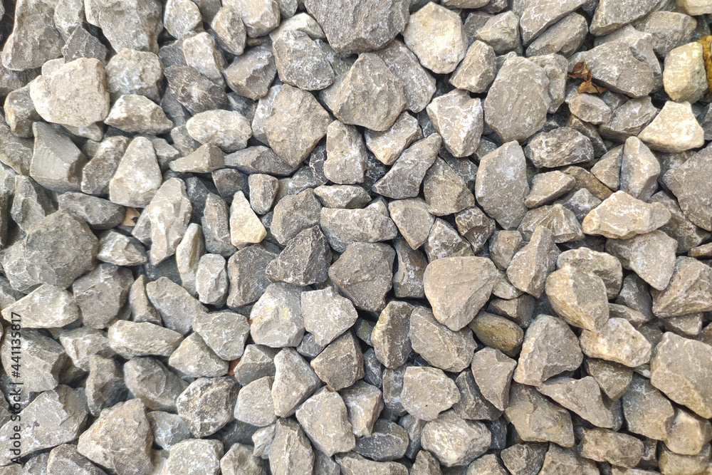 Gravel road stone pattern. Small rock or pebble textured. Top view. Gravel surface Gravel road stone pattern. Small rock or pebble textured. Top view. Gravel surface