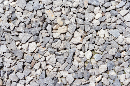 Gravel road stone pattern. Small rock or pebble textured. Top view. Gravel surface