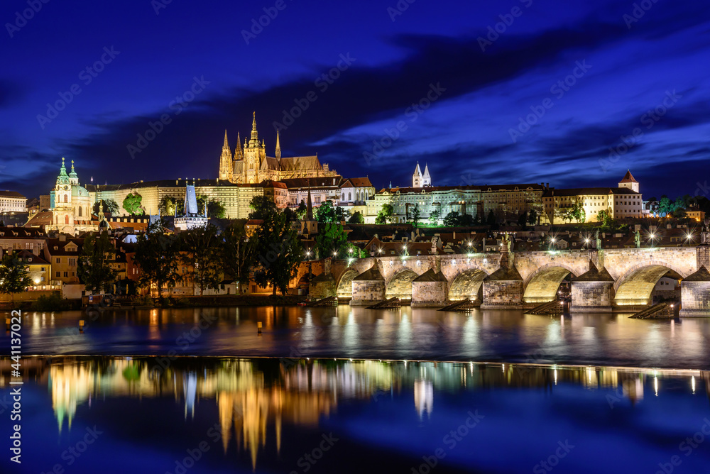 The famous Prague castle with the Charles bridge during a blue hour.