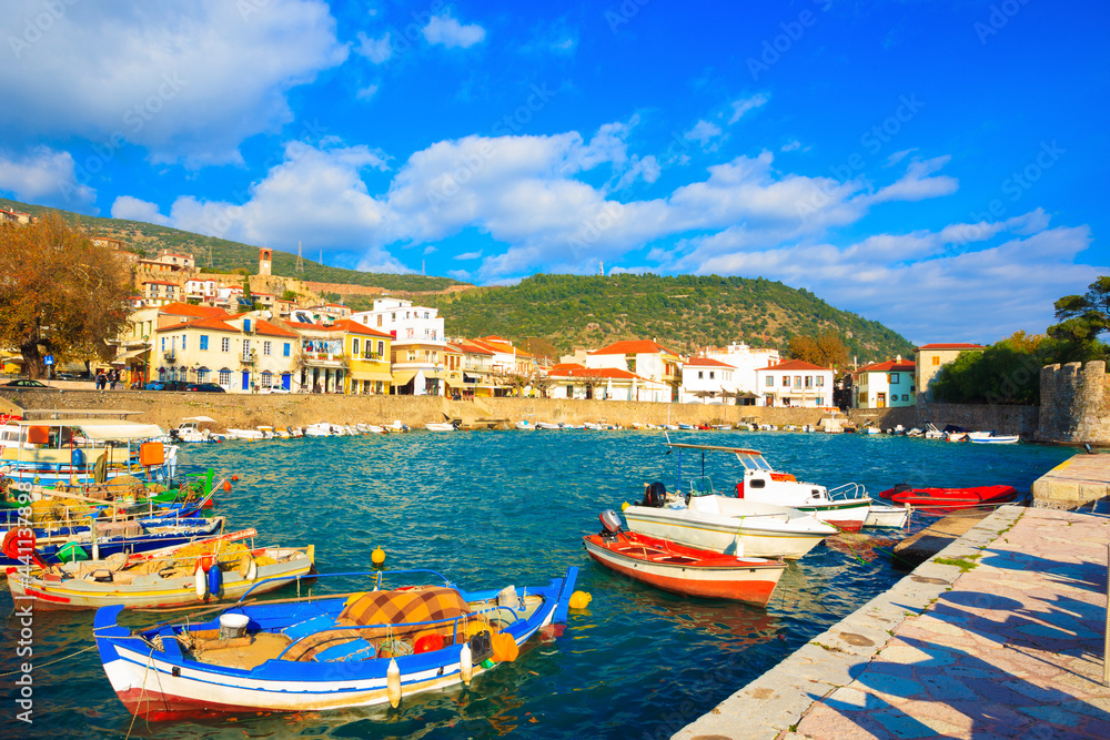 Obraz premium Greece, traditional fishing boats in main port of Nafpactos in Central Greece