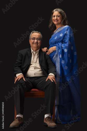 PORTRAIT OF A HAPPY OLD COUPLE POSING IN FRONT OF CAMERA © IndiaPix