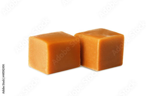Two sweet caramel candies on white background
