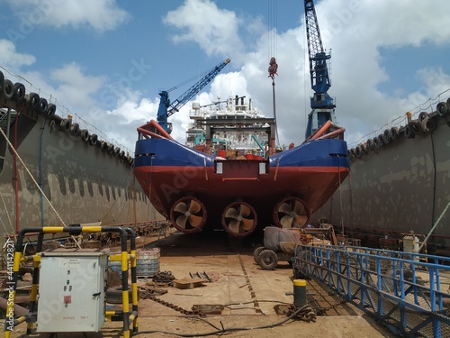 Fotobehang Maritime industry - Ocean Vessel in a dry dock in shipyard