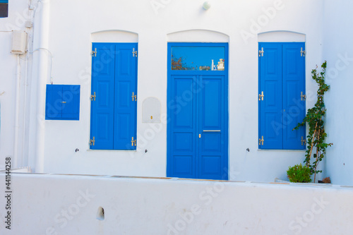 Beautiful blue window and door frames in Mykonos island cyclades Greece © korpithas