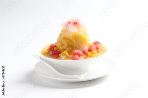 chilled mango and watermelon fruit snow ice kacang mountain in white bowl cafe sweet dessert menu