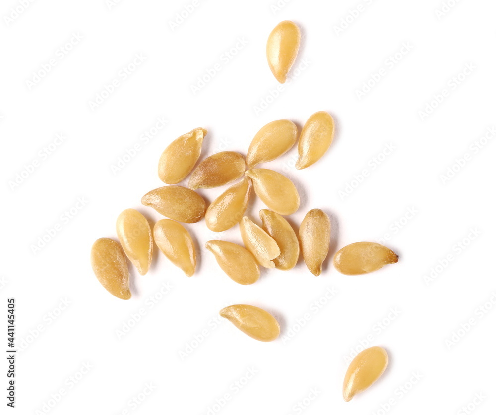 Gold flax seeds, golden linseed pile macro isolated on white background, top view Gold flax seeds, golden linseed pile macro isolated on white background, top view