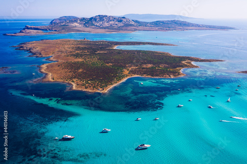 Fototapeta Naklejka Na Ścianę i Meble -  View from above, stunning aerial view of the Isola Piana island and the Asinara island bathed by a beautiful turquoise clear water. Stintino, Sardinia, Italy.
