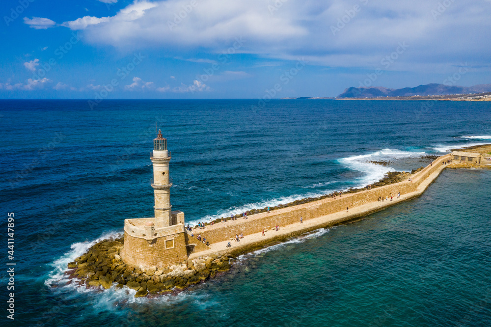 Picturesque old port of Chania. Landmarks of Crete island. Greece. Aerial view of the beautiful city of Chania with it's old harbor and the famous lighthouse, Crete, Greece. Picturesque old port of Chania. Landmarks of Crete island. Greece. Aerial view of the beautiful city of Chania with it's old harbor and the famous lighthouse, Crete, Greece.