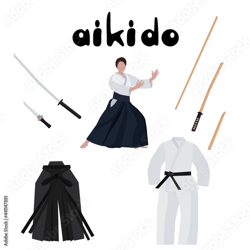 Aikido set, traditional clothes and weapons, man in stance practicing martial arts