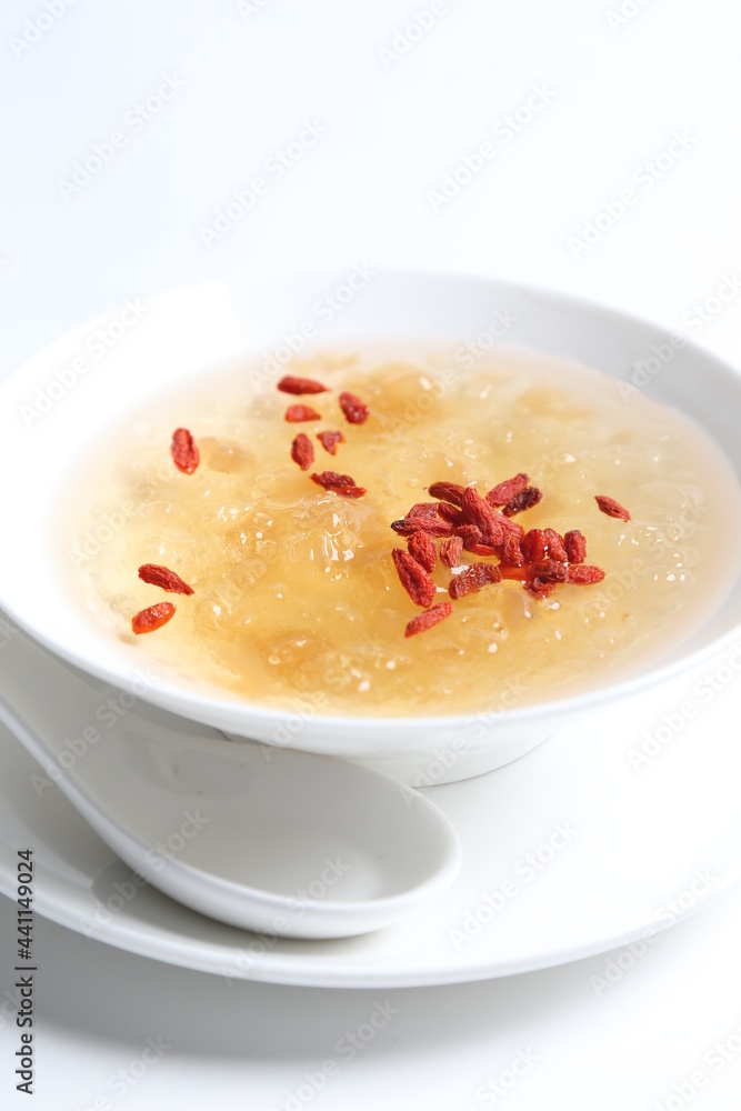 chilled double boiled fresh bird nest with hashima and wolf berries asian sweet soup in white bowl healthy dessert menu chilled double boiled fresh bird nest with hashima and wolf berries asian sweet soup in white bowl healthy dessert menu