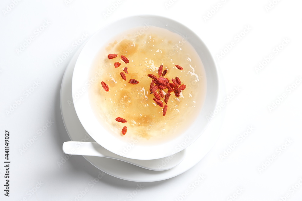 chilled double boiled fresh bird nest with hashima and wolf berries asian sweet soup in white bowl healthy dessert halal vegan food menu for Hong Kong cafe chilled double boiled fresh bird nest with hashima and wolf berries asian sweet soup in white bowl healthy dessert halal vegan food menu for Hong Kong cafe