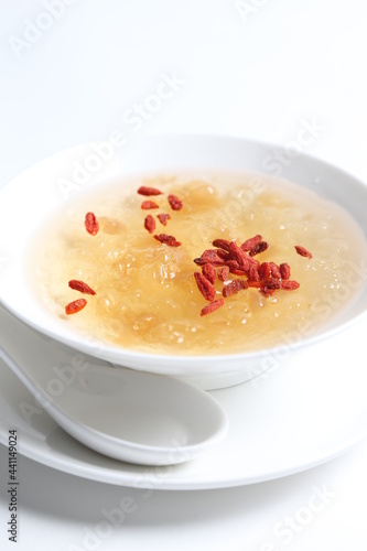 chilled double boiled fresh bird nest with hashima and wolf berries asian sweet soup in white bowl healthy dessert menu