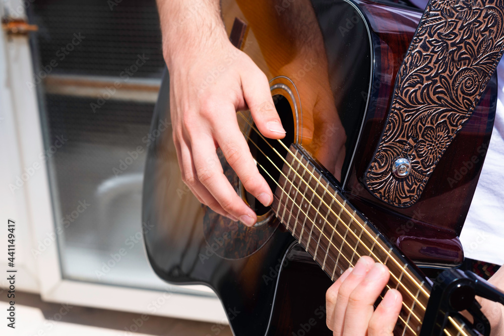 Guy playing guitar outside Guy playing guitar outside