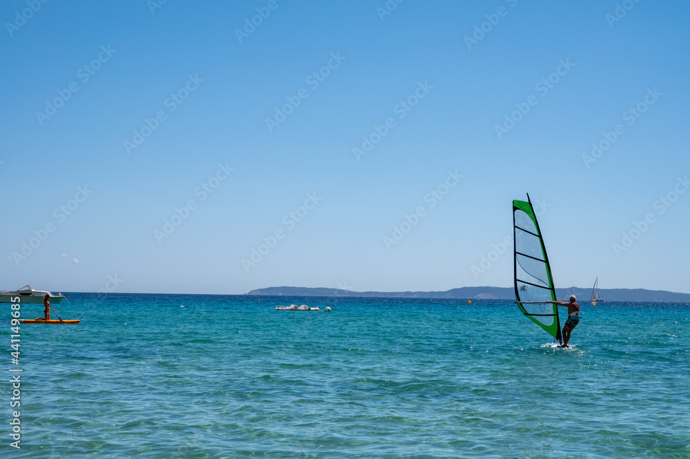 Summer vacation in France on Mediterranean sea, watersport activities in sunny day Summer vacation in France on Mediterranean sea, watersport activities in sunny day
