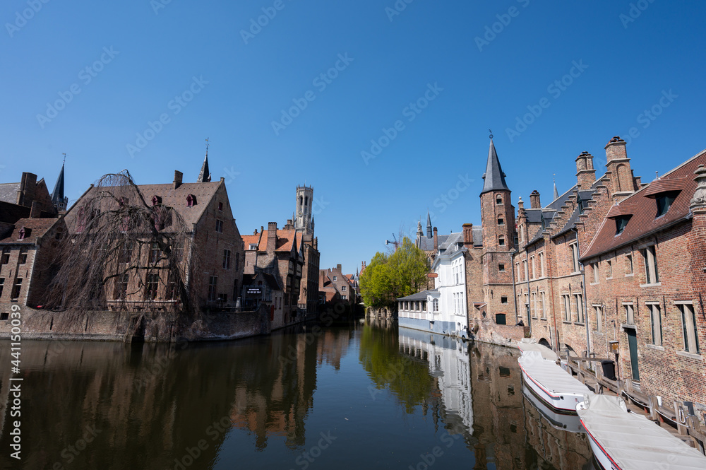 27 April 2021, Bruges, Belgium, walking on medieval Bruges streets in sunny day, travel destination