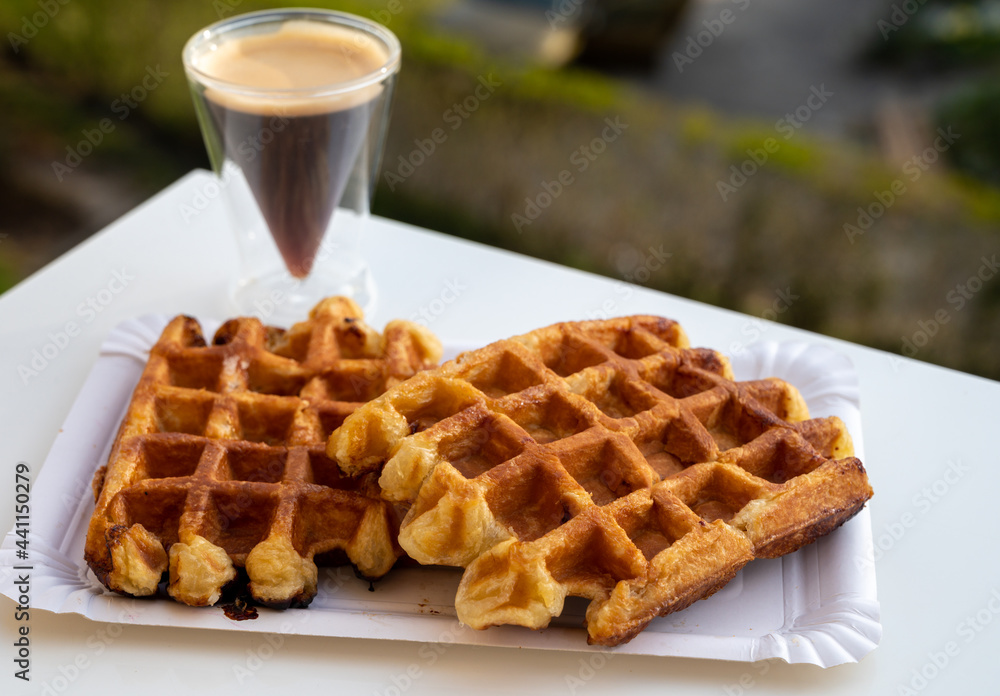 Belgian sugar waffles with black coffee served outdoor Belgian sugar waffles with black coffee served outdoor